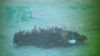 Foto Achiv: Apepre 100 Ayisyen chita sou yon vwalye apre li monte sou resif tou pre Staniel Cay, Bahamas, 26 Nov. 2013. 