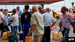 Cubans line up to buy fuel at a gas station in Havana, Sept. 12, 2019. President Miguel Diaz Canel blamed the United States Wednesday for Cuba's fuel shortage.
