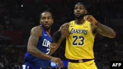 Kawhi Leonard, à gauche, contre LeBron James Staples Center, Los Angeles, Californie, le 22 octobre 2019. (Kirby Lee-USA TODAY Sports)
