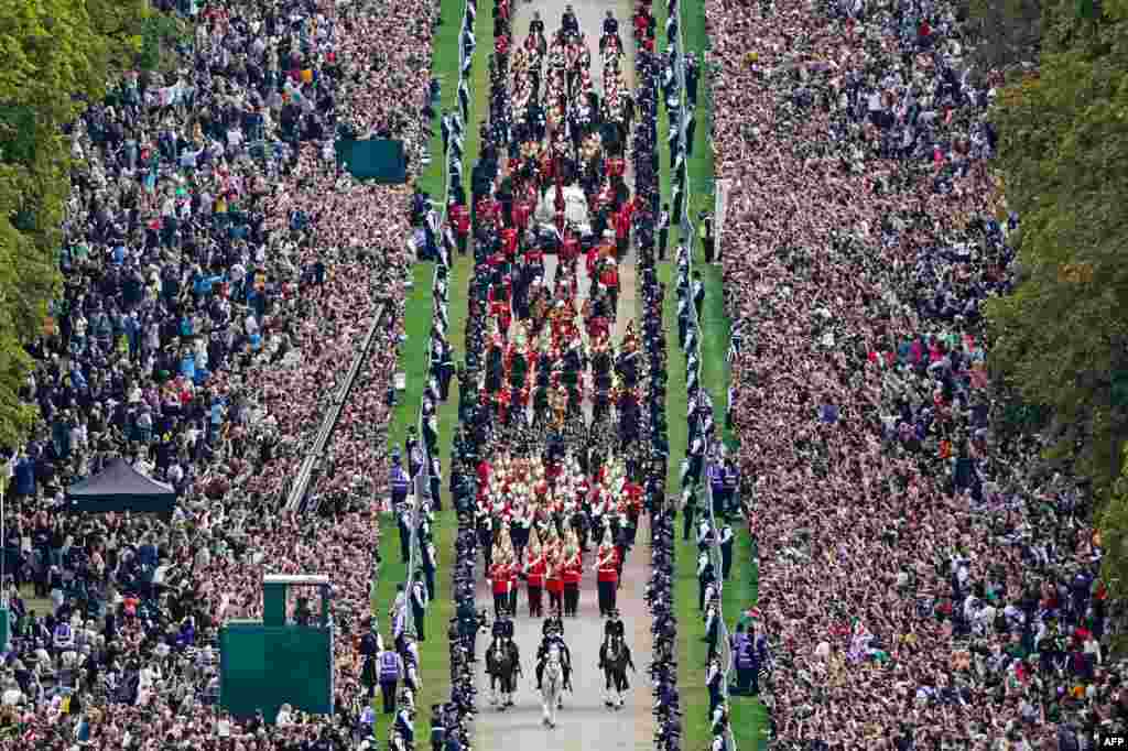 The Ceremonial Procession of the coffin of Queen Elizabeth II travels down the Long Walk as it arrives at Windsor Castle for the Committal Service at St. George&#39;s Chapel.