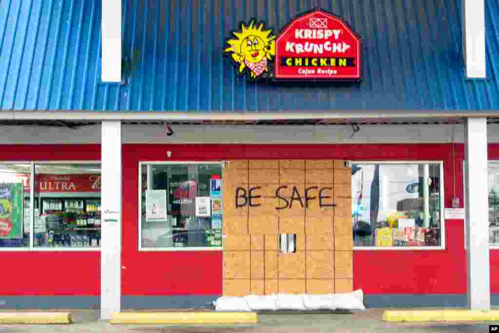A store in low-lying Delcambre, La., is boarded up in advance of Hurricane Laura, Aug. 26, 2020.