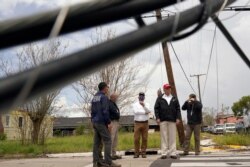 President Donald Trump tours damage from Hurricane Laura, Saturday, Aug. 29, 2020, in Lake Charles, La. (AP Photo/Alex Brandon)
