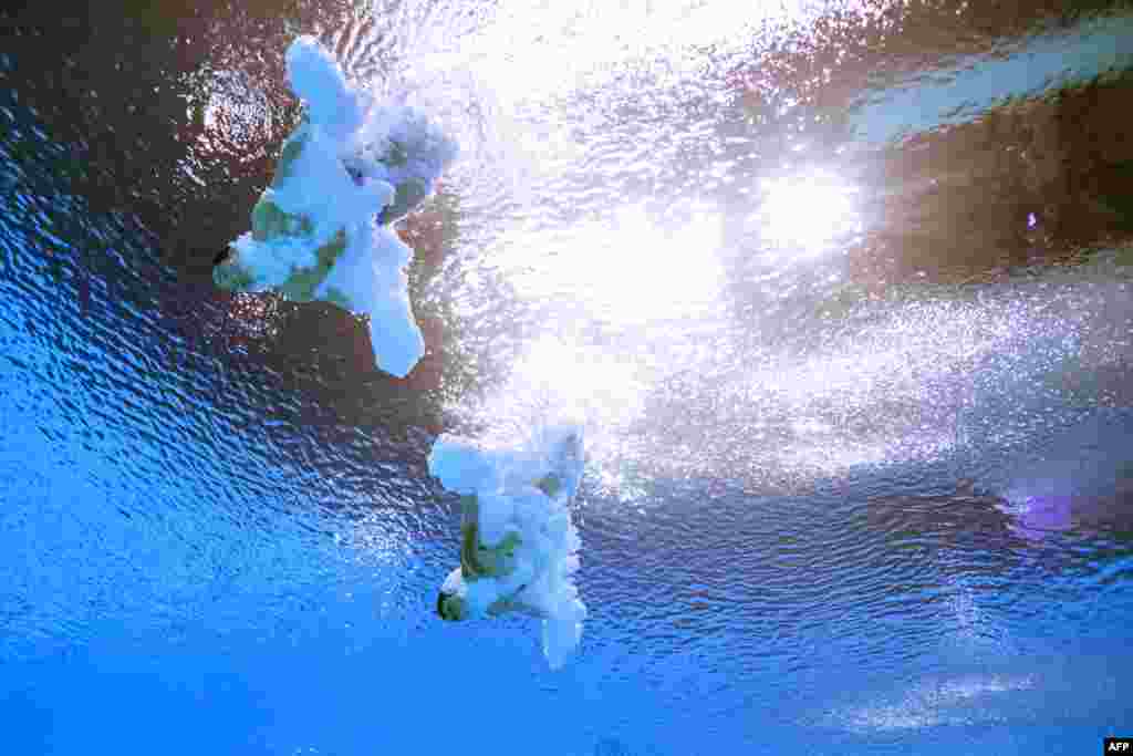 China&#39;s Yuan Cao and Zongyuan Wang compete during the men&#39;s 3m synchronized diving finals as part of the Budapest 2022 World Aquatics Championships at the Duna Arena in Budapest, Hungary.