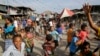 ARSIP - Anak-anak bermain di Port Moresby, Papua Nugini, 15 November 2018. Warga Papua Nugini mulai memberikan suara dalam pemilu, Senin, 4 Juli 2022. (AP/Aaron Favila, File)
