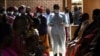 FILE - People wait to receive the AstraZeneca COVID-19 vaccine at Ndirande Health Centre in Blantyre, Malawi, March 29, 2021.