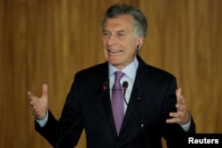Argentina's President Mauricio Macri speaks during a meeting with Brazil's President Jair Bolsonaro in Brasilia, Brazil, Jan. 16, 2019.