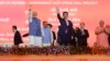 Japanese Prime Minister Shinzo Abe, right and Indian Prime Minister Narendra Modi wave during the ground breaking ceremony for high speed rail project in Ahmadabad, India, Sept. 14, 2017. 