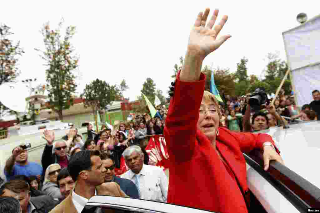 Chilean presidential candidate Michelle Bachelet waves to her supporters during a campaign event in Santiago. Bachelet was the clear winner in the presidential election, although she will have to wait until a second round runoff next month to seal her victory.