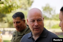 FILE - Jason Greenblatt, center, U.S. President Donald Trump's Middle East envoy, arrives to visit Kibbutz Nahal Oz, just outside the Gaza Strip, in southern Israel, Aug. 30, 2017.