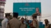 An Indian Police officer briefs his colleagues at the entrance of HITECH city, venue of the Global Entrepreneurship Summit in Hyderabad, India, Nov. 27, 2017. 