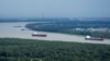 Mississippi river traffic moves in the aftermath of Hurricane Ida, Aug. 30, 2021, near Lafitte, La. 