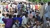 Civilians who fled their homes following an attacked by Islamist militants in Bama, take refuge at a School in Maiduguri, Nigeria, Wednesday, Sept. 3, 2014. A Nigerian senator says thousands of people are fleeing a northeastern city amid conflicting repor
