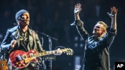 FILE - Bono (R) and The Edge of U2 are seen performing at the Innocence + Experience Tour at The Forum, in Inglewood, California, May 26, 2015.