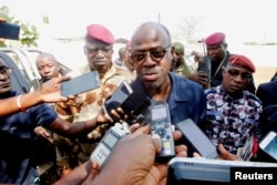 FILE - Ivory Coast's Minister of Defense Alain-Richard Donwahi speaks to the media in Bouake, Ivory Coast, Jan. 7, 2017.