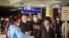 FILE - Passengers arriving on a China Southern Airlines flight from Changsha in China are screened upon their arrival at the Jomo Kenyatta International Airport, Jan. 29, 2020.