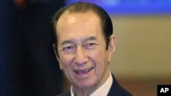 FILE - In this July 16, 2008, file photo, Macau casino mogul Stanley Ho reacts during the listing ceremony of Sociedade de Jogos de Macau,or SJM, at the Hong Kong Stock Exchange in Hong Kong. On Tuesday, May 26, 2020, the family of Stanley Ho, the…