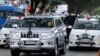 FILE - In this Oct. 18, 2014 file photo, former chief minister of India's Tamil Nadu state Jayaram Jayalalitha travels in a car accompanied by a row of cars with red beacon lights after being released from a prison in Bangalore, India.