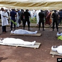 Bodies of people killed during a rally are seen at the capital's main mosque in Conakry, Guinea