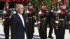 Presiden Ashraf Ghani melakukan inspeksi barisan pasukan kehormatan pada perayaan Hari Kemerdekaan Afghanistan di Kabul, Afghanistan, Senin, 19 Agustus 2019. 