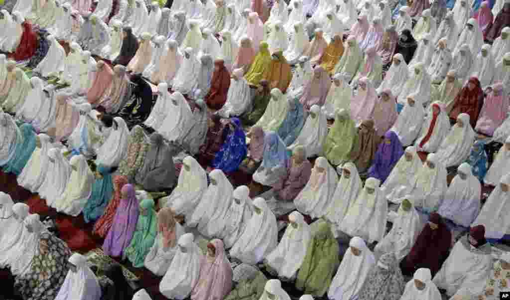 Muslim women perform an evening prayer called 'tarawih' marking the first eve of the holy fasting month of Ramadan, at Istiqlal Mosque in Jakarta, Indonesia.
