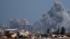 Smoke rises from an explosion in Gaza, as seen from Israel on Aug. 23, 2024.