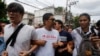 FILE - Student activists gather outside Pathumwan Police Station in Bangkok, Thailand, June 24, 2015.