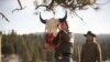 Mo (actor Mo Brings Plenty) raises a bison skull in a vision quest ceremony for Kayce Dutton (Luke Grimes) in Season 4, Episode 9 of Paramount+ "Yellowstone."