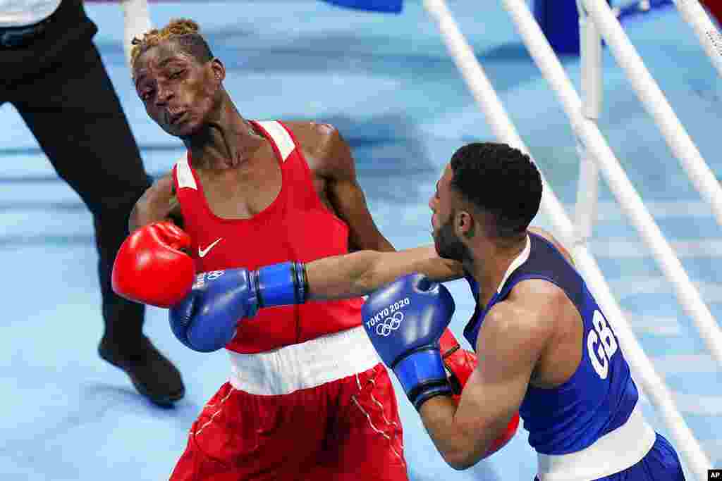 Zambia&#39;s Patrick Chinyemba, left, exchanges punches with Britain&#39;s Galal Yafai during their men&#39;s flyweight 52-kg boxing match at the 2020 Summer Olympics, Saturday, July 31, 2021, in Tokyo, Japan. (AP Photo/Frank Franklin II)