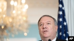 FILE - Secretary of State Mike Pompeo speaks to reporters at the State Department, Nov. 24, 2020, in Washington.