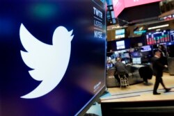 The Twitter logo is displayed above a trading post on the floor of the NY Stock Exchange, Feb. 8, 2018.
