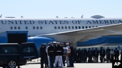 The flag-draped casket of the late Rep. John Lewis, D-Ga., is carried by a joint services military honor guard at Andrews Air Force Base in Md., July 29, 2020.