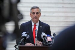 FILE - Georgia Secretary of State Brad Raffensperger gives an update on the state of the general election and ballot count during a news conference at the Capitol in Atlanta, Nov. 6, 2020.