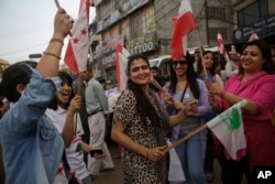 FILE - Supporters of Nepali Congress Party march during an election campaign event in Bhaktapur, Nepal, May 11, 2017.