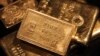 FILE - Gold bars are displayed at a gold jewelry shop in the northern Indian city of Chandigarh. 