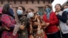 Relatives cry as the bodies of their family members, who died in Saturday's earthquake, are prepared for cremation along a river in Kathmandu, Nepal, April 28, 2015.