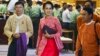 Aung San Suu Kyi, center, and other lawmakers from her National League for Democracy party leave after a regular session of parliament's lower house in Naypyitaw, Myanmar, Feb. 1, 2016. 