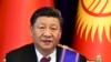 FILE - Chinese President Xi Jinping attends a joint news conference with Kyrgyzstan's President Sooronbai Jeenbekov, in Bishkek, Kyrgyzstan, June 13, 2019.