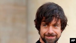 FILE - Twitter CEO Jack Dorsey leaves after his talk with French President Emmanuel Macron at the Elysee Palace in Paris, June 7, 2019. Dorsey's official account was hacked, Aug. 30, 2019, and sent racist and vulgar tweets to his 4.2 million followers. 