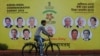 A cyclist rides past an ASEAN-India Commemorative Summit billboard on the side of the road in New Delhi, India, Jan. 23, 2018. 