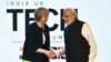British Prime Minister Theresa May is greeted by her Indian counterpart, Narendra Modi, at the India-U.K Tech Summit in New Delhi, Nov. 7, 2016. 