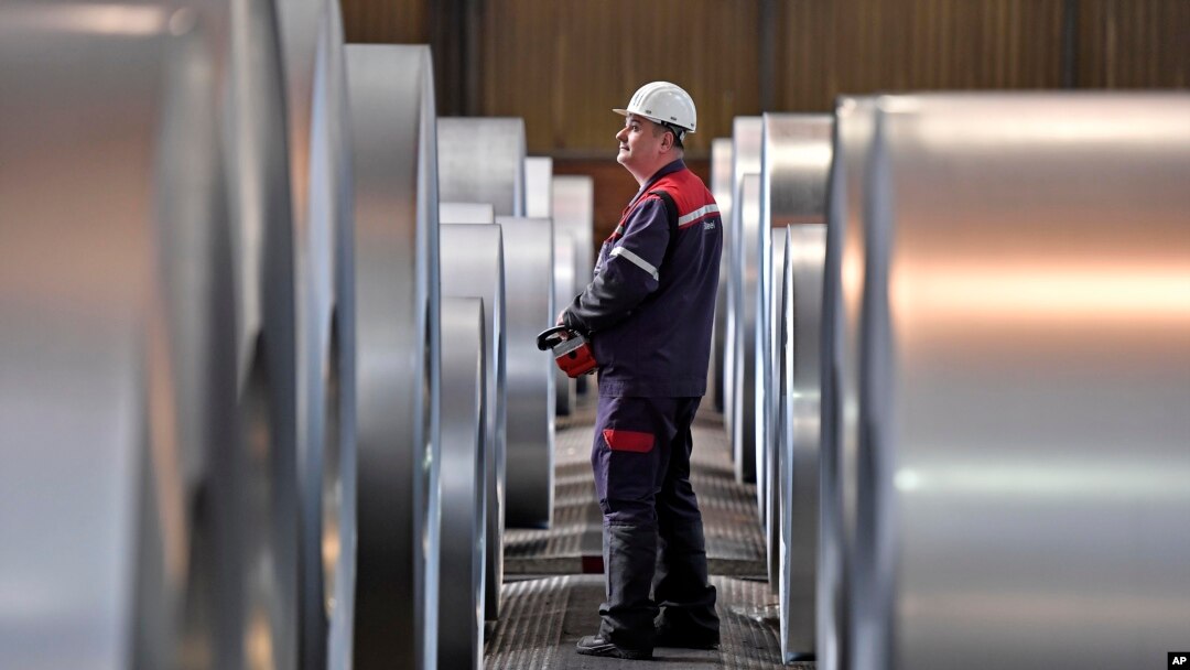FILE - A worker controls steel coils at the Thyssenkrupp steel factory in Duisburg, Germany, Friday, April 27, 2018. Duisburg is the biggest steel producer site in Europe. (AP Photo/Martin Meissner)