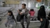 A Yemeni family waits in the departure hall at Sanaa International airport for a U.N. flight, Yemen, Feb. 3, 2020. The United Nations medical relief flight carrying patients from Yemen's rebel-held capital was the first in over three years. 