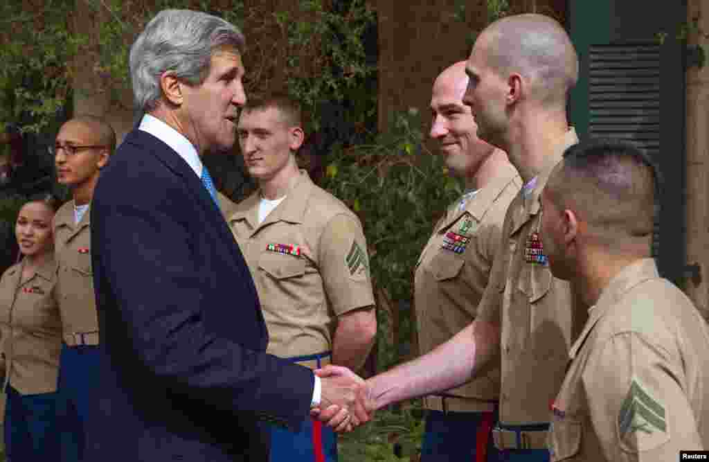 U.S. Secretary of State John Kerry greets members of the U.S. Marine Corps Detachment before speaking to U.S. foreign service workers during his visit to the U.S. Consulate General in Jerusalem, April 8, 2013.