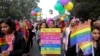 Gay rights activists and their supporters hold colorful balloons and placards as they participate in a gay pride parade in New Delhi, India, Nov. 12, 2017. 