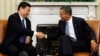 2012年2月14日奥巴马总统在白宫椭圆形办公室会见习近平。（路透社）
