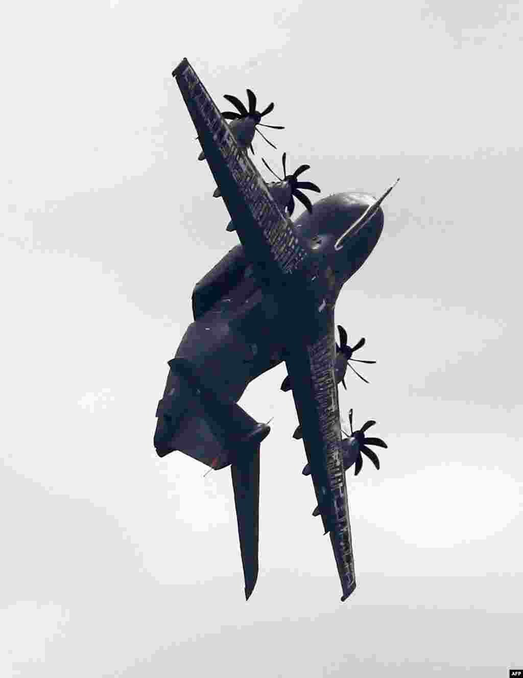 An Airbus A400M flies during the International Aerospace Exhibition (ILA) in Schoenefeld, Germany.