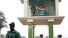 FILE - Members of the police stand guard in front of a replica of Pieta at Holy Rosary Church in Dhaka.