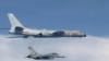 This photo taken July 22, 2017, by Taiwan's Defense Ministry shows a Taiwanese jet intercepting an H-6 bomber from China over the East China Sea, part of the Pacific and home to small islands whose ownership is disputed by China, Japan and Taiwan.