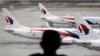 Fleet of Malaysia Airline planes on the tarmac of the Kuala Lumpur International Airport, in Malaysia, Jan. 29, 2015.
