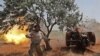 Un combattant syrien du Front de libération nationale (FNL) soutenu par la Turquie, vise à partir de la province d'Idlib sous contrôle rebelle, les positions du régime dans la partie nord de la province de Hama, le 22 mai 2019. (Photo OMAR HAJ KADOUR / AF-